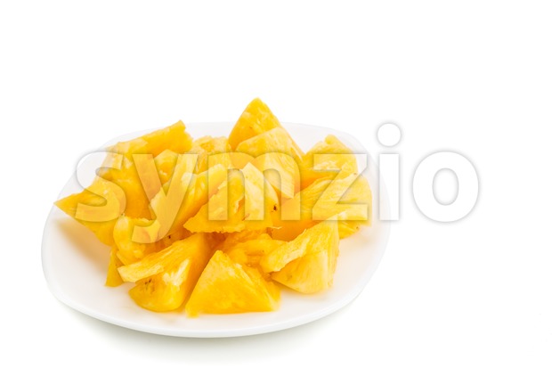 Freshly cut juicy, sweet nutritious pineapple fruit isolated in white. Stock Photo