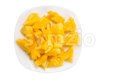Freshly cut juicy, sweet nutritious pineapple fruit isolated in white. Stock Photo