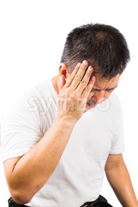 Matured man suffering from painful headache Stock Photo