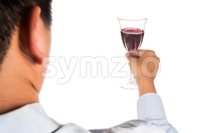 Man holding red wine in crystal glass and ready to toast and cheers Stock Photo