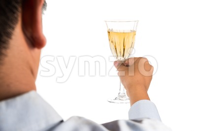 Man holding white wine in crystal glass and ready to toast and cheers Stock Photo
