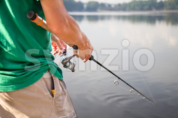 Leisure recreational fishing at a lake on a beautiful morning Stock Photo