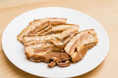 Stew pork slice and solidified fats from canned food Stock Photo