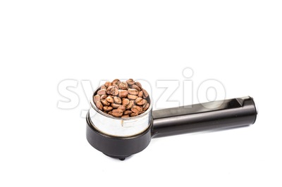 Coffee portafilter filled with coffee beans in white background Stock Photo