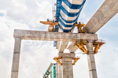 Construction of a mass transit train line in progress with heavy infrastructure. This photo shows the progress in joining the various blocks/modules Stock Photo
