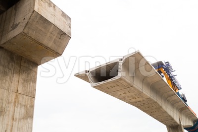 Construction of a mass transit train line in progress with heavy infrastructure. This photo shows the progress in joining the various blocks/modules Stock Photo