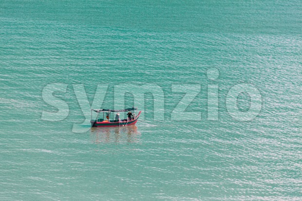 Fishermen on boat in the open sea fishing Stock Photo