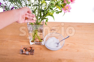 Add copper coins and sugar into vase keep flowers fresher Stock Photo