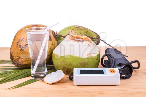Fresh coconut juice helps to lower blood pressure and hypertension Stock Photo