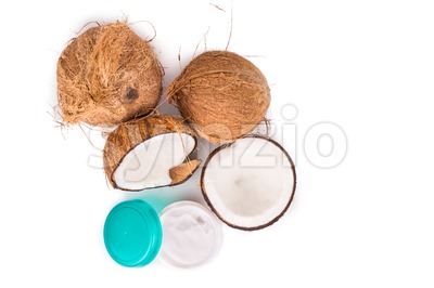 Tub containing coconut oil are used as moisturizer for skin Stock Photo