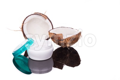 Tub containing coconut oil are used as moisturizer for skin Stock Photo