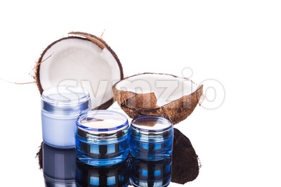Tubs containing coconut oil are used as moisturizer for skin Stock Photo