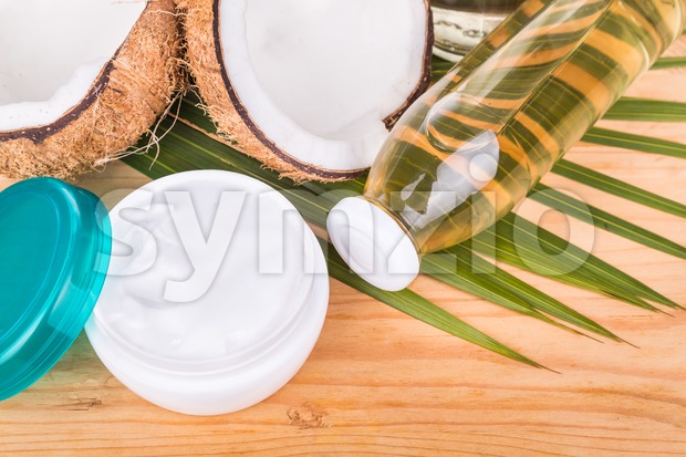 Cold pressed extra virgin coconut oil in bottles and jar Stock Photo