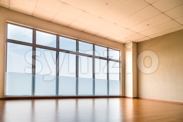 Perspective view of empty studio illuminated with light from windows Stock Photo