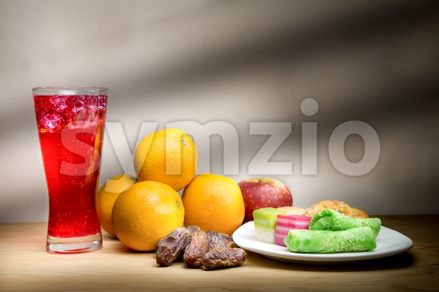 Cold drinks, dates, sweet kuih common iftar break fast food. Stock Photo