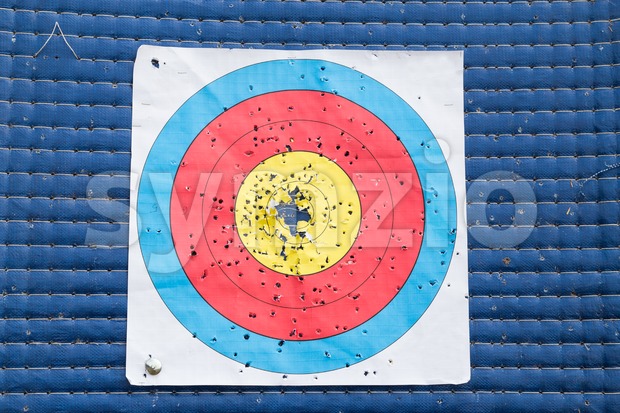 Closeup on used and worn out outdoor archery target board Stock Photo