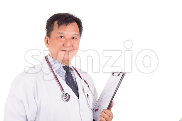 Matured, confident Asian male medical doctor with stethoscope, white coat Stock Photo