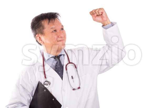 Successful matured Asian medical doctor rejoicing with raised hand Stock Photo