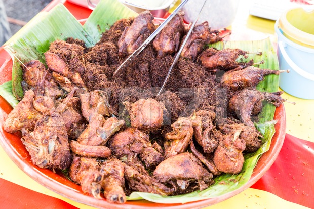 Fried chicken with spice, popular at food bazaar during Ramadan. Stock Photo