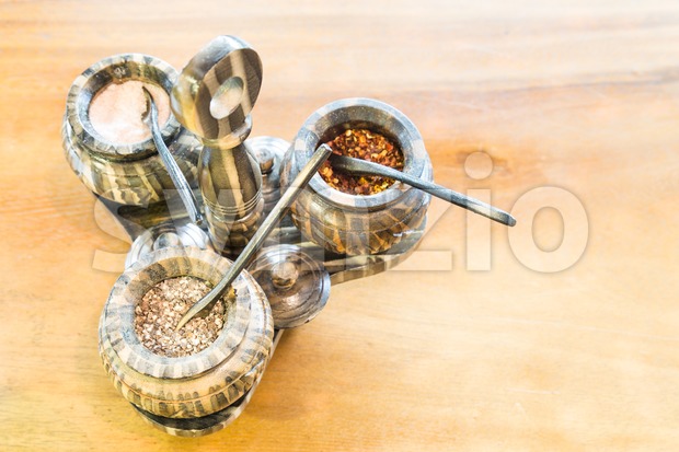 Salt, pepper, chili flakes spices in container Stock Photo