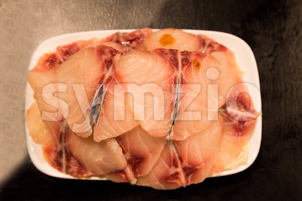 Fish fillet as ingredient for cooking on plate Stock Photo
