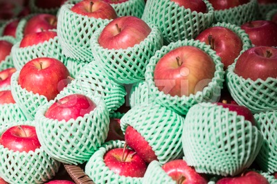 Heap of organic juicy apple with protective foam mesh Stock Photo