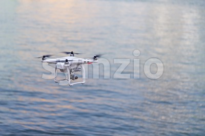 Closeup on drone flying over river background Stock Photo