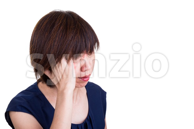 Asian women suffering from painful headache migraine Stock Photo