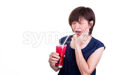 Asian women suffers toothache pain after drinking ice cold drinks Stock Photo