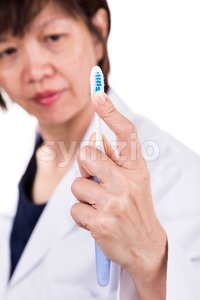 Dentist touch and feel soft and slim tapered bristle toothbrush Stock Photo