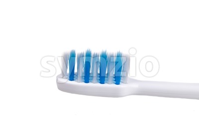 Closeup of small head toothbrush with soft slim tapered bristle Stock Photo