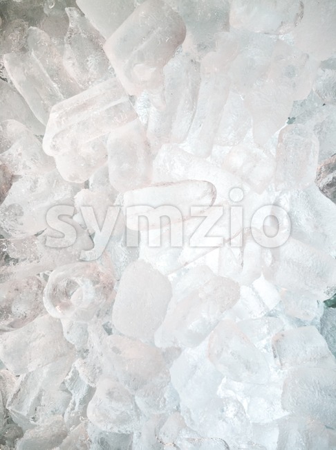 Ice cubes lighted from behind as background Stock Photo