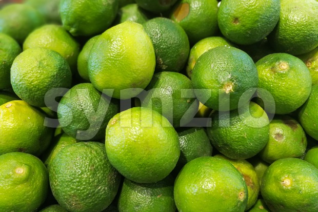 Heap of whole fresh organic lime Stock Photo