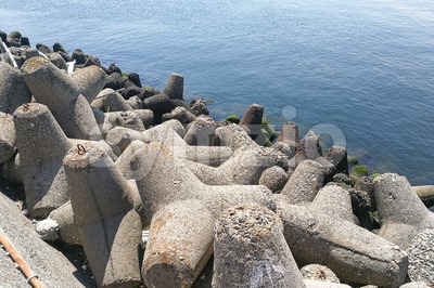 Concrete tetrapod at coast line to prevent erosion and protection Stock Photo