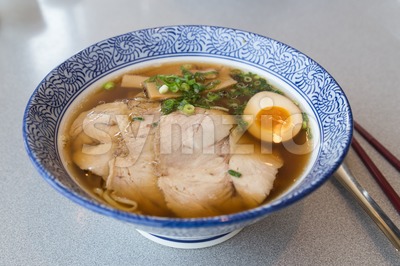 Delicious authentic Japanese Ramen with Pork and Egg in bowl Stock Photo
