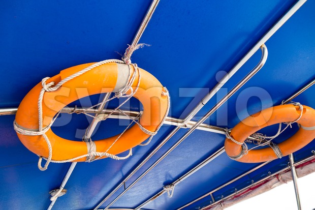 Life buoy attached to the ceiling of boat Stock Photo