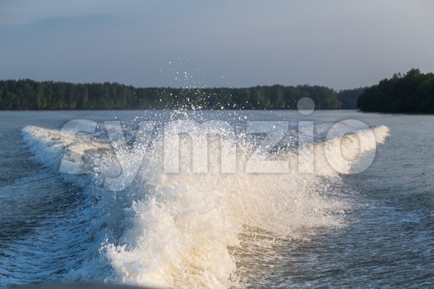 Wave generated by speed boat engine in ocean Stock Photo
