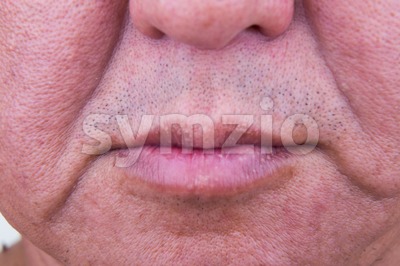 Closeup on saggy cheek skin of matured Asian man Stock Photo