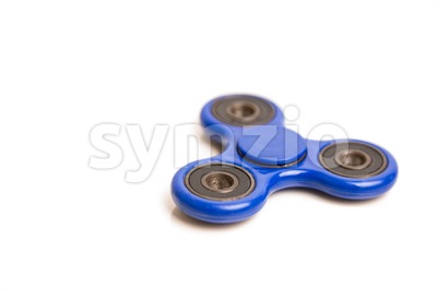 Blue fidget spinner in white background Stock Photo