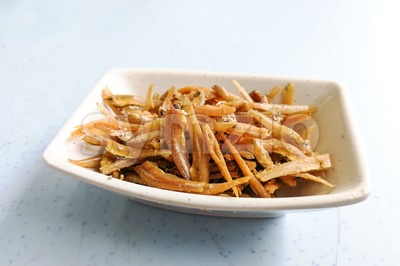 Plate of fried crispy anchovies, Asian recipe Stock Photo