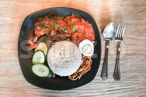 Nasi lemak with fried chicken, popular cuisine in Malaysia Stock Photo