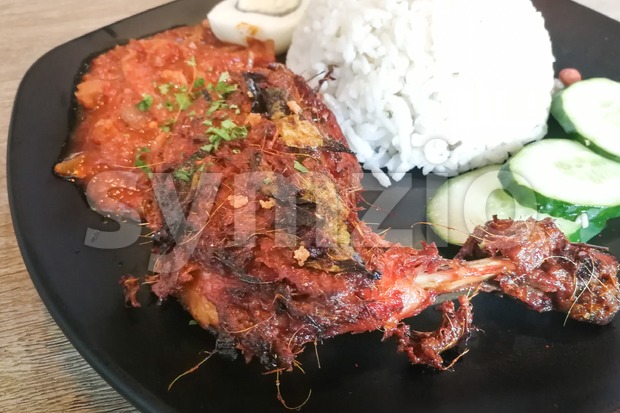 Nasi lemak with fried chicken, popular cuisine in Malaysia Stock Photo