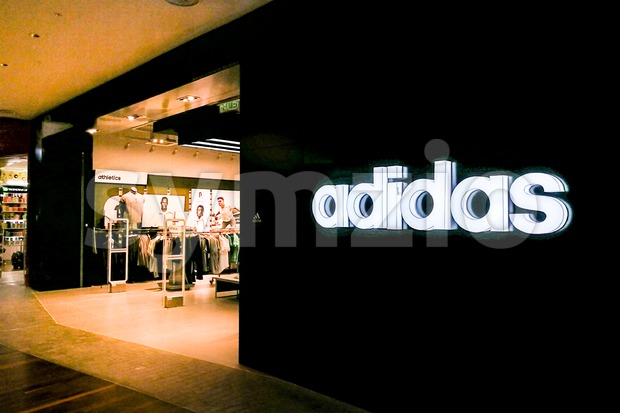 KUALA LUMPUR, Malaysia, June 25, 2017: Adidas AG is a German multinational corporation, headquartered in Herzogenaurach, Germany, that designs and Stock Photo