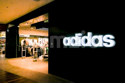 KUALA LUMPUR, Malaysia, June 25, 2017: Adidas AG is a German multinational corporation, headquartered in Herzogenaurach, Germany, that designs and Stock Photo