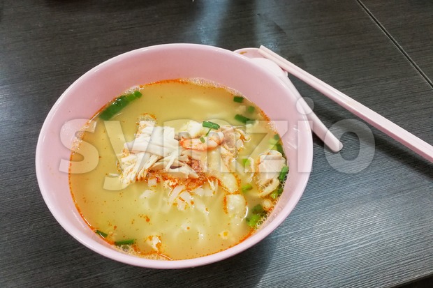Bowl of popular delicious Malaysia Ipoh sliced chicken noodle soup Stock Photo