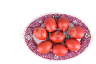 Red color eggs on oriental Chinese plate for good luck Stock Photo