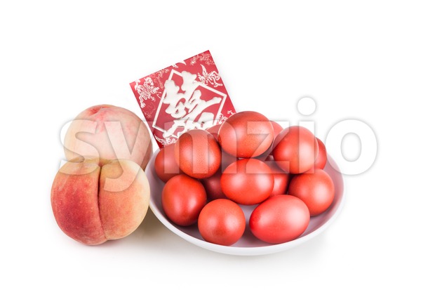 Red color eggs and peach with envelope Chinese word Celebration Stock Photo