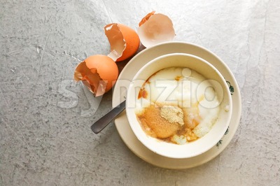 Asian traditional breakfast half boiled eggs with soy sauce pepper Stock Photo