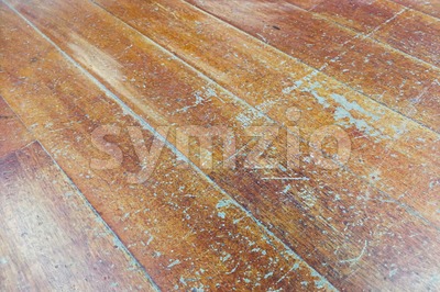 Damaged seasoned wooden floor plank with scratch marks needs restoration Stock Photo