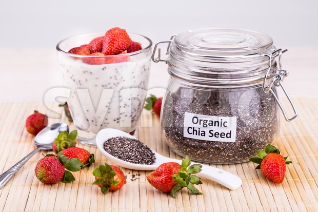 Chia seeds pudding with strawberry fruits, healthy nutritious anti-oxidant superfood. Stock Photo